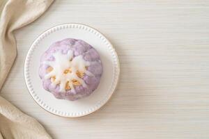 taro bun with white sugar cream and nut photo