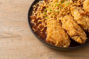 Korean instant noodles with fried chicken or Fried chicken ramyeon photo