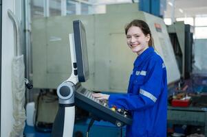 Female Robotics engineers Using Controller to Remotely Operate programming and Manipulating Robot Hand, Industrial Robotics Design, High Tech Facility, Modern Machine Learning. photo