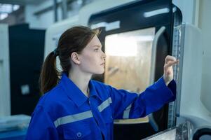 Female Robotics engineers Using Controller to Remotely Operate programming and Manipulating Robot Hand, Industrial Robotics Design, High Tech Facility, Modern Machine Learning. photo