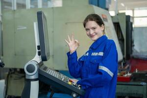 Female Robotics engineers Using Controller to Remotely Operate programming and Manipulating Robot Hand, Industrial Robotics Design, High Tech Facility, Modern Machine Learning. photo