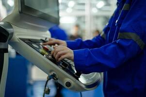 Close up of Robotics engineers Using Controller to Remotely Operate programming and Manipulating Robot Hand, Industrial Robotics Design, High Tech Facility, Modern Machine Learning. photo