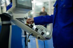 Close up of Robotics engineers Using Controller to Remotely Operate programming and Manipulating Robot Hand, Industrial Robotics Design, High Tech Facility, Modern Machine Learning. photo