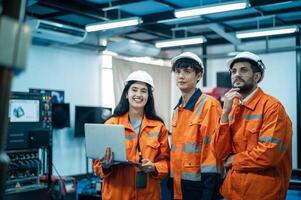 A group of Robotics engineers working with Programming and Manipulating Robot Hand, Industrial Robotics Design, High Tech Facility, Modern Machine Learning. Mass Production Automatics. photo