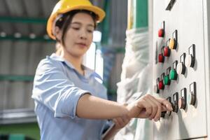 Engineers or factory managers wearing safety helmet inspect the machines in the production line. Utility inspector check machine and test the system to meet the standard. machine, maintenance. photo