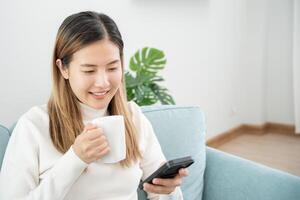 woman using smartphone for online shopping at home. stay home, technology, electronic commerce, internet, market place, final or summer or big sale, payment, discount for credit, offer, Low price photo