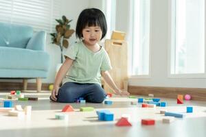 Happy Asia children play and learn toy blocks.family is happy and excited in the house. daughter having fun spending time, Activity, development, IQ, EQ, meditation, brain, muscles, essential skills. photo