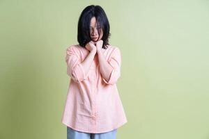 Photo of young Asian woman on background