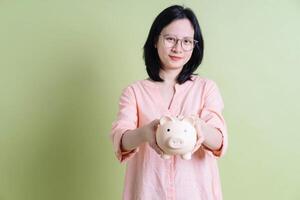 Photo of young Asian woman on background