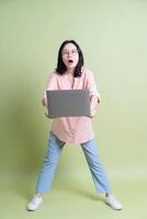 Photo of young Asian woman on background