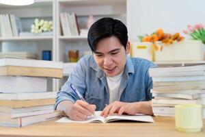 Young Asian businessman working at home photo