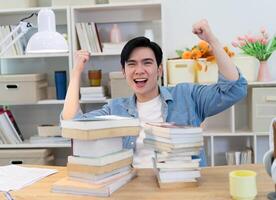 Young Asian businessman working at home photo