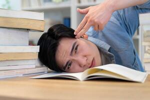 Young Asian businessman working at home photo