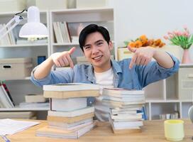 Young Asian businessman working at home photo