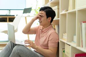 Photo of young Asian man at home