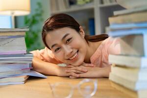 Young Asian woman working at home photo