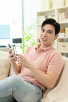 Photo of young Asian man at home