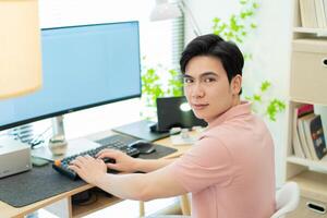 Photo of young Asian man at home