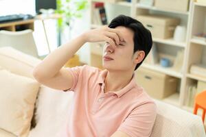 Photo of young Asian man at home