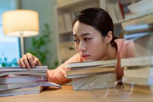 Young Asian woman working at home photo