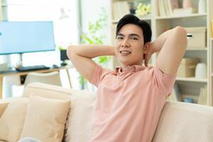 Photo of young Asian man at home