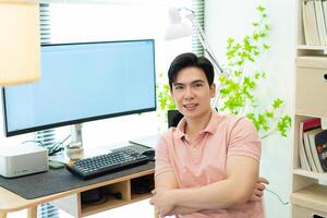 Photo of young Asian man at home