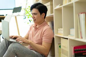 Photo of young Asian man at home