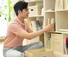 Photo of young Asian man at home