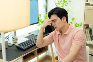 Photo of young Asian man at home