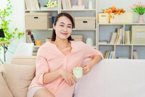Young Asian woman at home photo