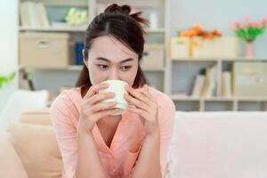 Young Asian woman at home photo