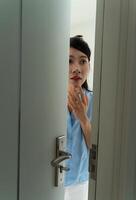 Young Asian woman at home photo