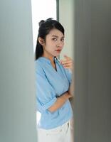 Young Asian woman at home photo