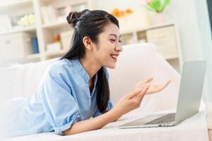 Photo of young Asian girl at home