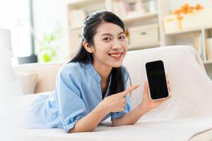 Photo of young Asian girl at home