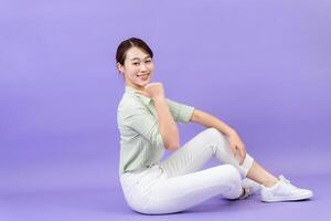 Photo of young Asian woman on purple background