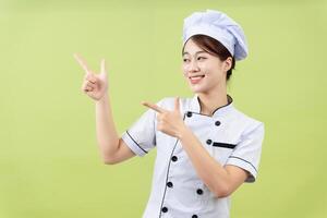 foto de joven asiático hembra cocinero en antecedentes
