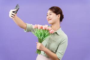 Photo of young Asian woman on purple background