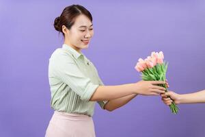 Photo of young Asian woman on purple background