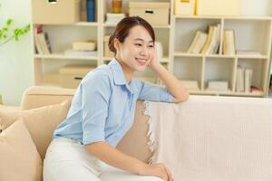 Photo of young Asian woman at home