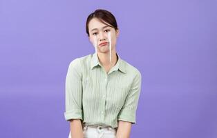 Photo of young Asian woman on purple background