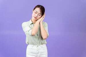 Photo of young Asian woman on purple background