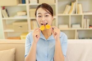 Photo of young Asian woman at home