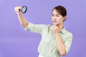 Photo of young Asian woman on purple background