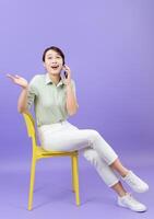 Photo of young Asian woman on purple background