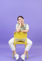 Photo of young Asian woman on purple background