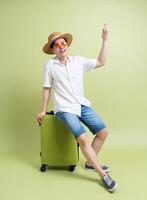 Photo of young Asian man on green background