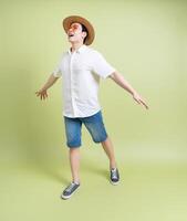 Photo of young Asian man on green background