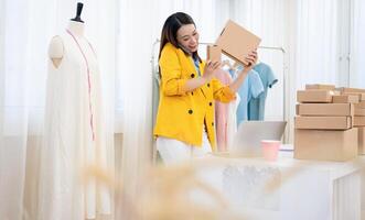 Photo of young Asian woman selling online