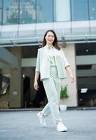 Portrait of young Asian businesswoman outside the office photo